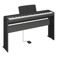 Diagonal side view of the P-145BTB (black model) in combination with the optional stand and sustain pedal