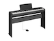 Diagonal side view of the P-145BTB (black model) in combination with the optional stand and sustain pedal