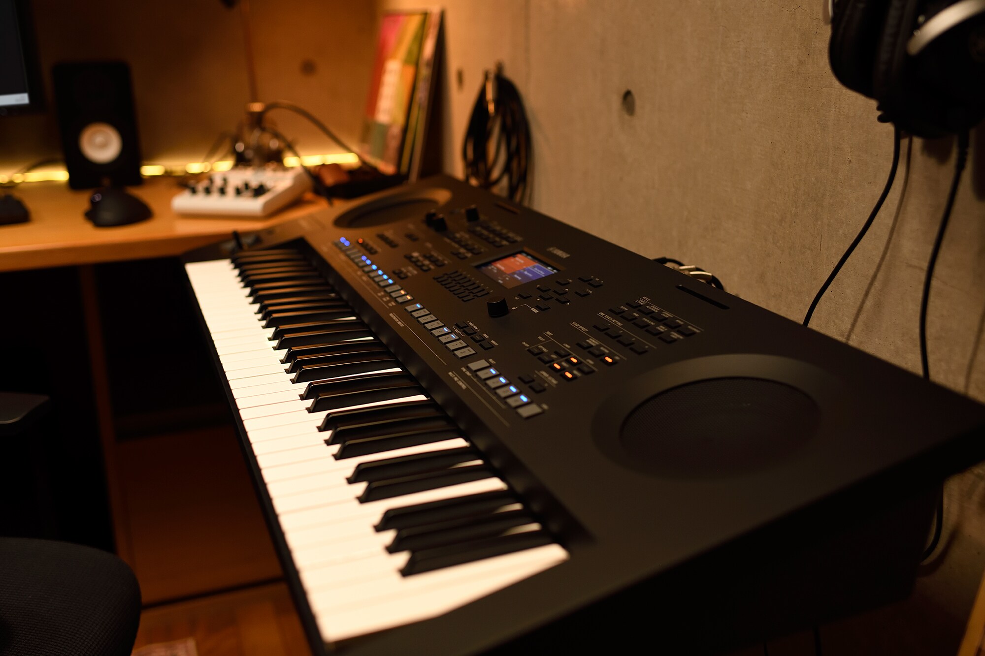 A home music workspace with a computer and keyboard