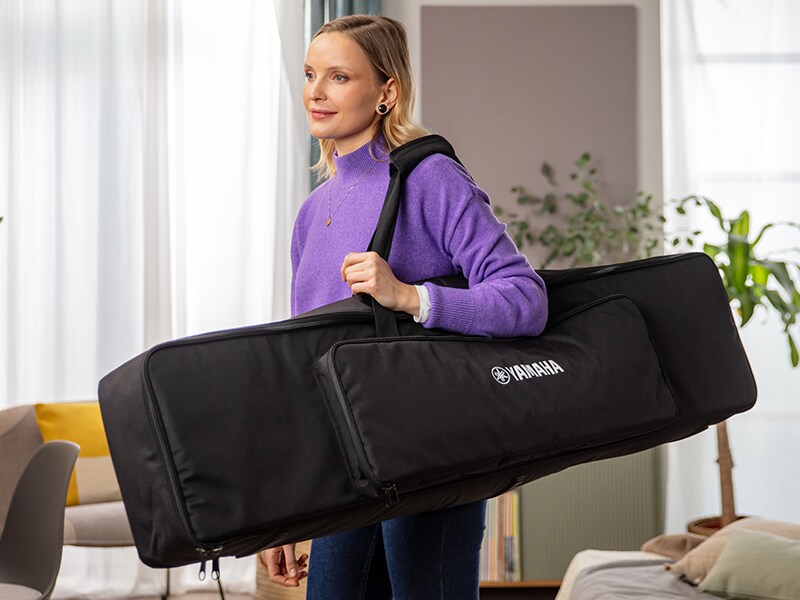 A person carrying the P-145 dedicated keyboard bag on their shoulder