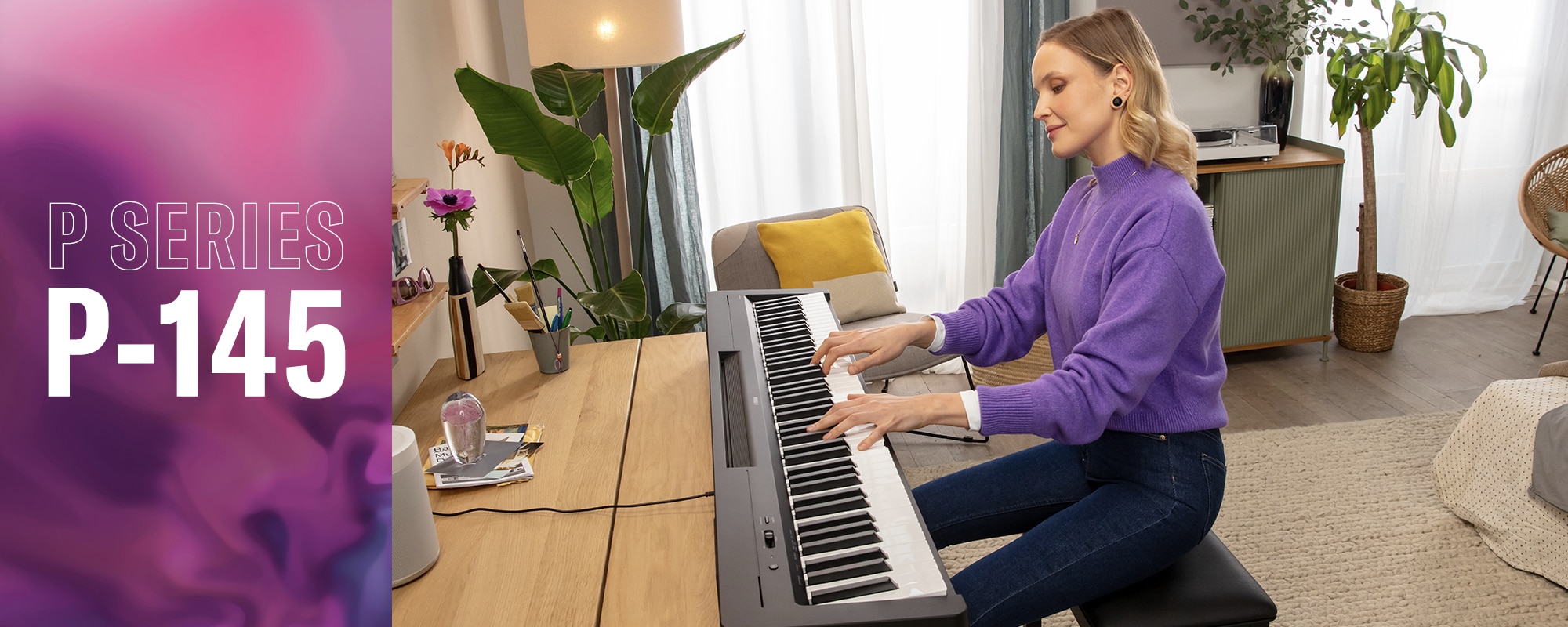 A person playing the P-145B on a desk