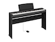 Diagonal side view of the P-225B (black model) in combination with the optional stand and sustain pedal