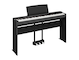 Diagonal side view of the P-225B (black model) in combination with the optional stand and metal three-pedal pedal unit