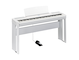 Diagonal side view of the P-525WH (white model) in combination with the optional stand and metal sustain pedal