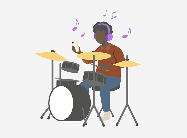 A man enjoying practicing the drums using the stem separator function of the Extrack music practice app